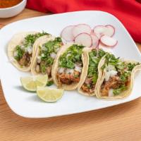 Carnitas Taco · Braised Pork. Served with corn tortilla, cilantro and onion.