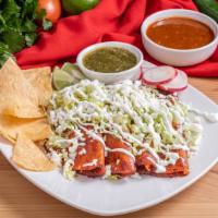 4 Carnitas Enchiladas · Braised Pork. Served with lettuce, sour cream and Mexican cheese.