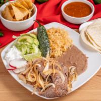 Azada Combo Plate · Steak. Served with beans, rice and tortillas.