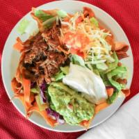 Taco Salad · Served with refried beans, cheese, guacamole, sour cream, tomatoes, and your choice of chick...