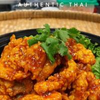 Khan Toke'S Crispy Chicken · Saucy crispy chicken dish served with a side of rice. The sauce was secretly created by Khan...