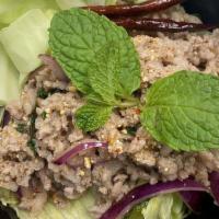 Larb (Gf) · Flavorful and spicy meat salad, widely served in Laos and Thailand, and better if pair with ...