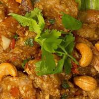 Goong Prik Kluea (Seasoned Crispy-Shrimp) · Deep-fried battered shrimps, stir with savory seasoning and cashew nuts in a hot wok.