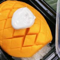Mango & Sticky Rice (V)(Gf) · Ripe mango and coconut-flavored sticky rice, topped with coconut cream