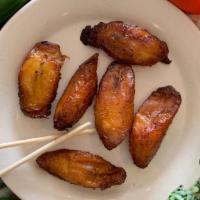 Fried Plantains  · Two fried plantains.