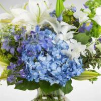 Breezy By The Sea · As fresh as a sea breeze, this arrangement will be sure to bring the beauty of the sea to an...