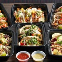 Fiesta Pack For 4 · Choice of four styles of tacos (12 tacos total) served with Wok-Charred Street Corn, Asian G...