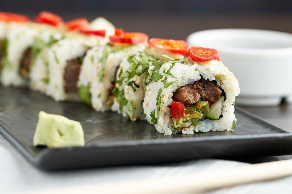 Carne Asada Roll · jalapeno, roasted red peppers, avocado, pickled fresno chilies, salsa verde