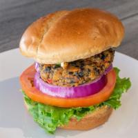 Black Bean Burger · Vegan. Shack made with Black Bean Patty, Tomato, Onion, Greens, and Lemon Tahini. 
Served wi...