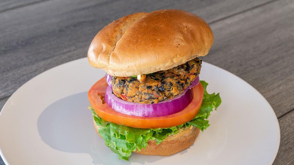 Black Bean Burger · Vegan. Shack made with Black Bean Patty, Tomato, Onion, Greens, and Lemon Tahini. 
Served with choice Sides.