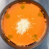 Tomato Basil Bisque Cup · creamy tomato and basil soup, parmesan, basil oil