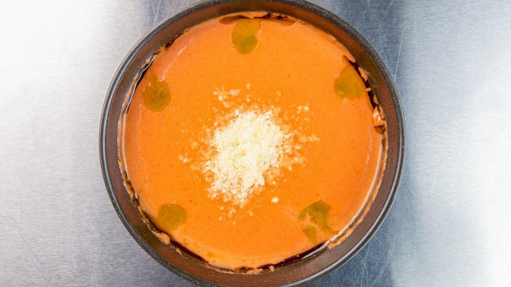 Tomato Basil Bisque Bowl  · creamy tomato and basil soup, parmesan, basil oil