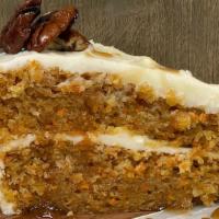 Carrot Cake  · layers of moist carrot cake, cream cheese buttercream filled and topped, candied pecans, car...