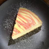 Goat Cheesecake  · goat cheese, pomegranate swirl, toasted almond graham cracker crust