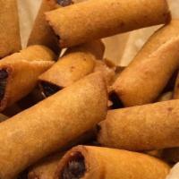 Lumpiang Shanghai (Egg Roll) · A delicious mix of ground pork and vegetables rolled in pastry wrapper and deep-fried. Serve...