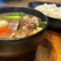 Sinigang (Tamarind Soup) · A tangy tamarind soup with assorted vegetables.