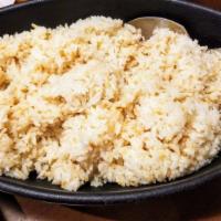 Garlic Rice · Jasmine rice deliciously stir-fried in golden garlic bits.