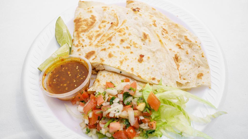 Quesadilla · Large flour tortilla filled with Jack and cheddar cheese, choice of chicken, ground beef, or chorizo. Topped with sour cream, guacamole, tomatoes, and onions. add grilled chicken or carne for an additional charge.