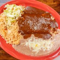 Mole Enchiladas  · Two tortillas rolled and filled with your choice of cheese, chicken, or ground beef and topp...