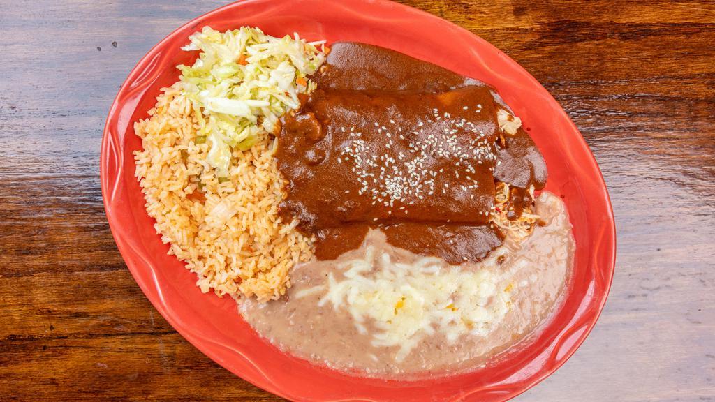 Mole Enchiladas  · Two tortillas rolled and filled with your choice of cheese, chicken, or ground beef and topped with a sweet mole sauce and Jack cheese.
