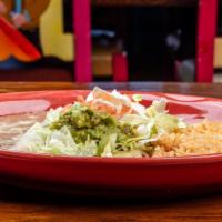 Enchiladas Deluxe · Flour tortillas filled with your choice of cheese, chicken, or ground beef, topped with gree...