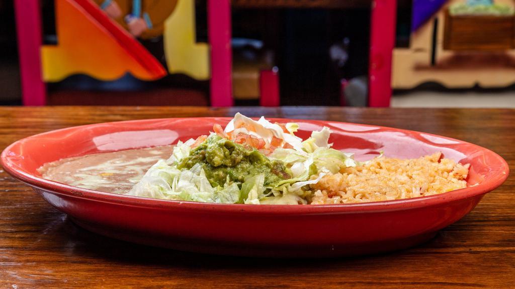 Enchiladas Deluxe · Flour tortillas filled with your choice of cheese, chicken, or ground beef, topped with green tomatillo sauce, Monterrey Jack cheese, lettuce, tomatoes, onions, guacamole, and sour cream. No coleslaw.