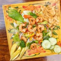 Ensalada Costa Alegre · Grilled shrimp, romaine lettuce, iceberg 
 ettuce, spinach, tomatoes, onions, corn, avocados...