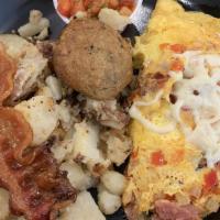 Denver Omelet · Peppers, onion, mushroom, bacon, ham, and tomatoes, served with a side of skillet potatoes o...