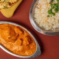 Murg Tikka Makhani · Chicken kababs cooked in a herb and tomato sauce with a buttery taste. A specialty of the ho...