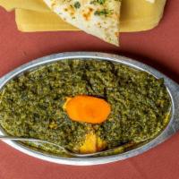 Saag Paneer · Homemade cheese and spinach sauteed with a touch of cream.