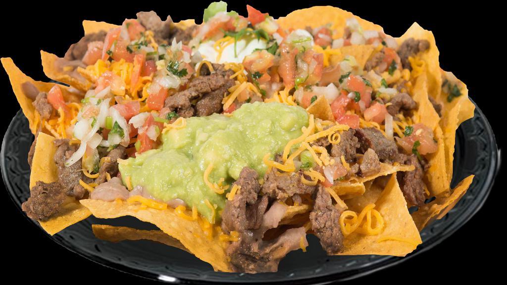 Nachos · Your choice of protein. Comes with beans and cheese on top of chips. Guacamole, sour cream, and pico de gallo on the side.