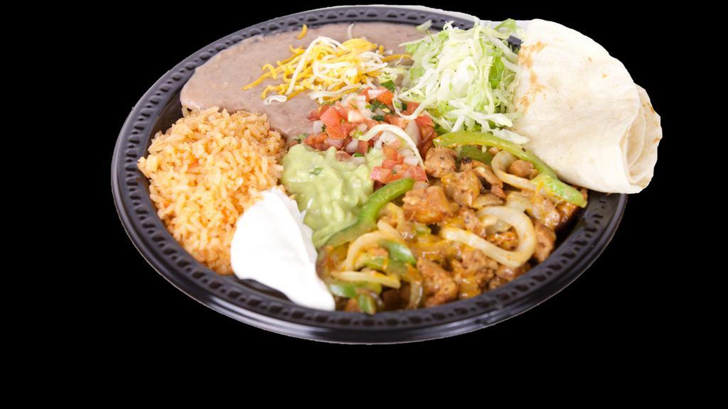 Fajitas Plate Combo · Your choice of chicken or steak fajitas cooked with bell pepper and onion. Comes with lettuce, guacamole, sour cream. pico de gallo, rice and beans with cheese on the side. Also comes with tortillas.