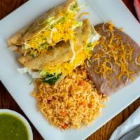 2 Beef Tacos Combo · Two crispy tacos choice of shredded beef or ground beef (lettuce and cheese). Rice and beans...