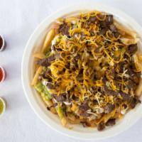 Carne Asada Fries · Made with french fries, steak, guacamole, pico de gallo, sour cream, beans, and cheddar chee...
