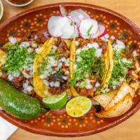 Street Tacos · Tacos served on two small soft corn tortillas. Served with onion, cilantro, roasted jalapeño...