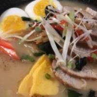 Tonkotsu Ramen · Pork bone-flavored soup with chashu pork, egg and vegetables.