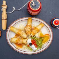 Flautas · Two flour tortillas stuffed with chicken or beef served with guacamole and sour cream.