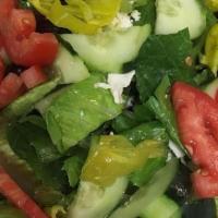 Greek Salad · Fresh romaine lettuce, chopped tomatoes, cucumbers, red onions, feta cheese, kalamata olives...