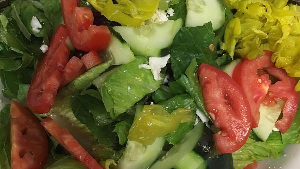 Greek Salad · Fresh romaine lettuce, chopped tomatoes, cucumbers, red onions, feta cheese, kalamata olives tossed in balsamic vinaigrette dressing.