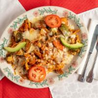 Mexican Stir Fry Chicken · A bed of spanish rice topped with sautéed carrots, chicken, broccoli, mushrooms, green peppe...