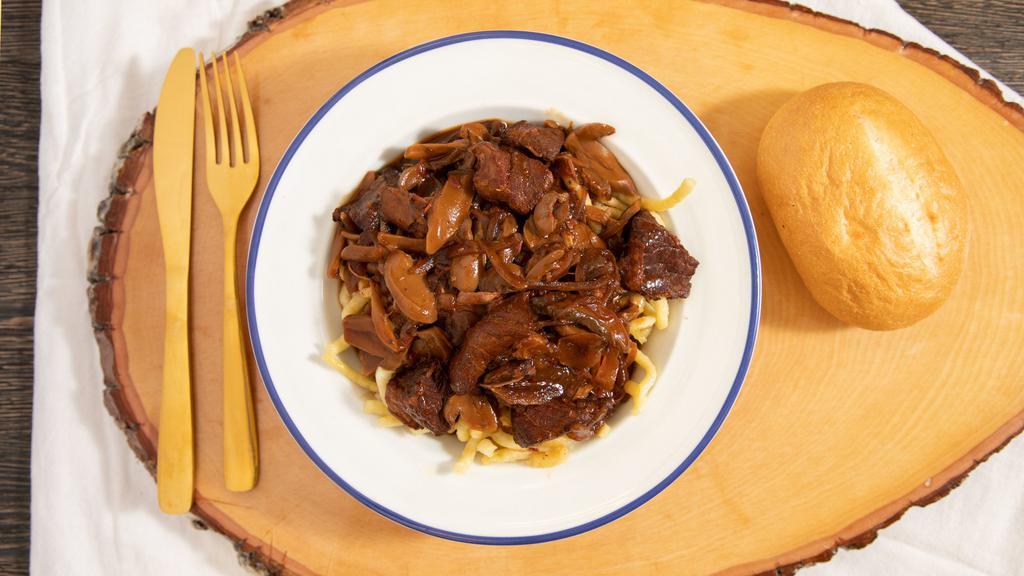 Spicy Hungarian Goulash · Gulasch. Served over Spaetzel and includes a roll.