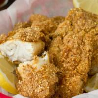 Southern Fried Tilapia · Two pieces of southern fried tilapia and two sides.