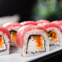 Tuna Lover Roll · Inside out roll filled with spicy tuna, wrapped in sushi rice and nori (seaweed) and topped ...