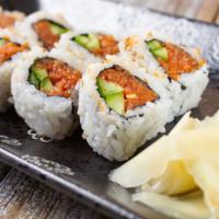 Spicy Tuna Roll · Fresh chopped tuna and spicy mayo wrapped in sushi rice and nori and a drizzle of our house ...