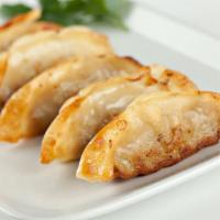Chicken Dumplings-Gyoza (5) · Gyoza-style dumplings stuffed with minced chicken, garlic ginger and scallions. Pan fried un...
