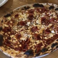 Pizza Margherita · Crushed tomato sauce, fresh mozzarella, pecorino, olive oil, fresh basil.