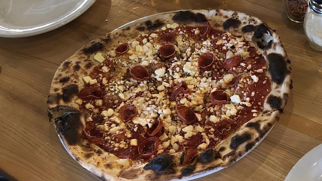 Pizza Margherita · Crushed tomato sauce, fresh mozzarella, pecorino, olive oil, fresh basil.