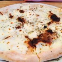 Bianca · White pie (no tomato), fresh mozzarella, pecorino, garlic, oregano, and olive oil.