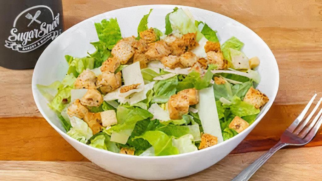 Caesar Salad · Traditional Caesar Salad made with chopped romaine, shaved parmesan, herb toasted croutons and Caesar dressing