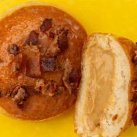 Maple Bacon Butterscotch · Butter ’Scotch’ pastry cream, dipped in maple ganache, and garnished with applewood smoked b...
